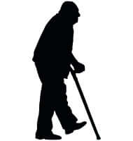 Silhouette of an elderly man walking with a cane